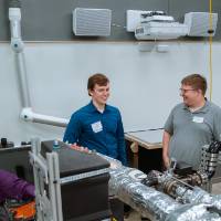 Students circled around an engineering project